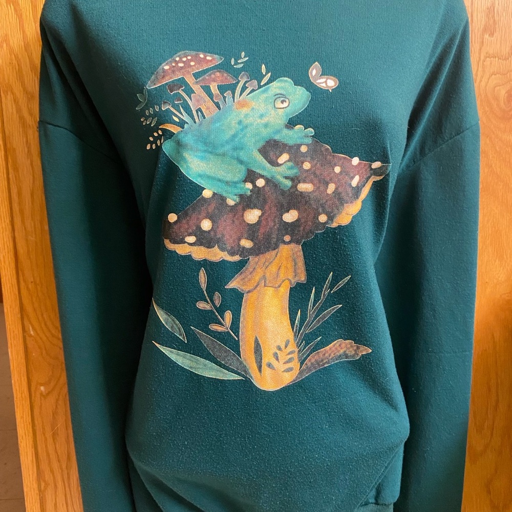 Green Sweater with Frog and Mushroom Design